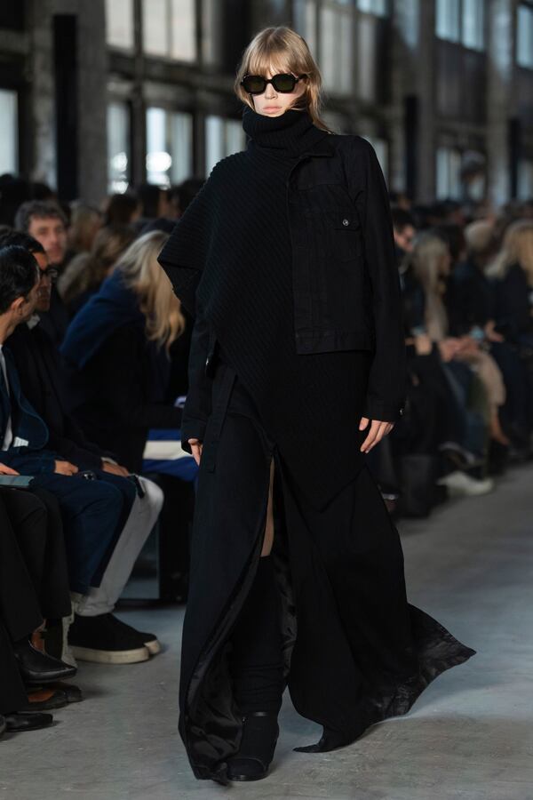 A model wears a creation as part of the Sacai Fall/Winter 2025-2026 Womenswear collection presented in Paris, Monday, March 10, 2025. (Photo by Scott A Garfitt/Invision/AP)