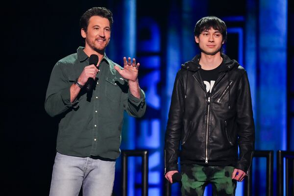 Miles Teller, left, and Chad Comey speak during the FireAid benefit concert on Thursday, Jan. 30, 2025, at Intuit Dome in Inglewood, Calif. (Photo by Jordan Strauss/Invision/AP)