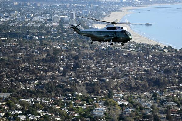 Marine One, with President Donald Trump aboard, flies above devastation caused by wildfires, in areas of Los Angeles, Friday, Jan 24, 2025. (Mandel Ngan/Pool via AP)