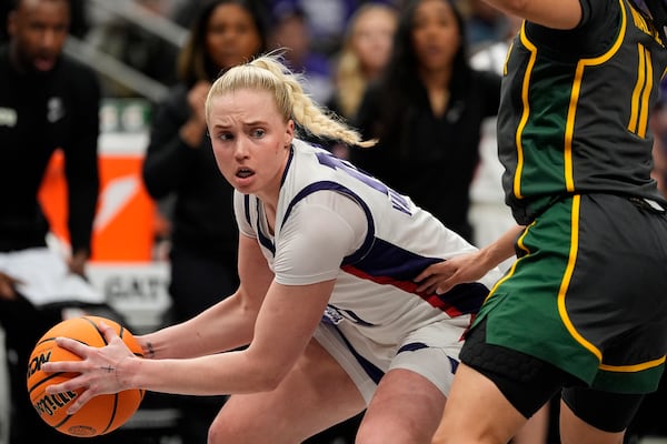 TCU guard Hailey Van Lith looks to pass around Baylor guard Jada Walker (11) during the second half of an NCAA college basketball game for the Big 12 women's tournament championship Sunday, March 9, 2025, in Kansas City, Mo. (AP Photo/Charlie Riedel)