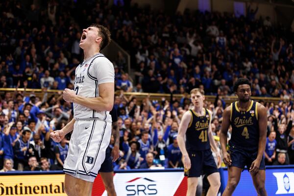 Duke's Cooper Flagg (2) reacts after a dunk ahead of Notre Dame's Matt Allocco (41) and Sir Mohammed (4) during the second half of an NCAA college basketball game in Durham, N.C., Saturday, Jan. 11, 2025. (AP Photo/Ben McKeown)