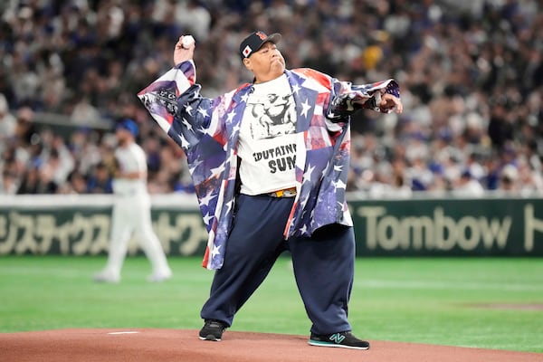 Former Sumo wrestler, Konishiki, throws out the ceremonial first pitch before an MLB Japan Series baseball game between the Los Angeles Dodgers and Chicago Cubs in Tokyo, Japan, Tuesday, March 18, 2025. (AP Photo/Eugene Hoshiko)