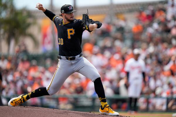 Pittsburgh Pirates starting pitcher Paul Skenes (30) delivers during the first inning of a spring training baseball game against the Baltimore Orioles, Saturday, March 1, 2025, in Sarasota, Fla. (AP Photo/Stephanie Scarbrough)