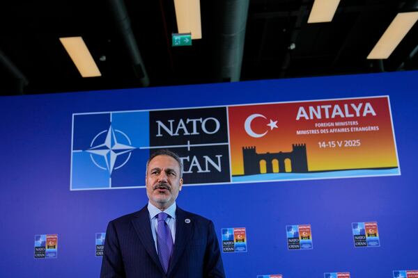 Turkey's Foreign Minister Hakan Fidan talks to journalists as he arrives for a NATO's informal meeting of foreign ministers in Antalya, southern Turkey, Thursday, May 15, 2025. (AP Photo/Khalil Hamra)