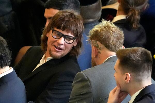 FILE - Theo Von, left speaks with Jake Paul in Emancipation Hall at the 60th Presidential Inauguration, Jan. 20, 2025, at the U.S. Capitol in Washington. (Jasper Colt/Pool Photo via AP, File)