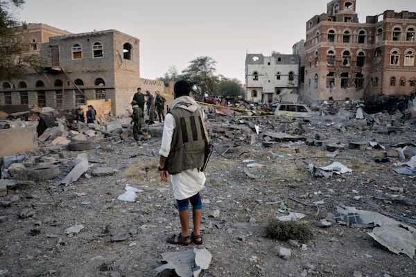 Locals inspect the site reportedly struck by U.S. airstrikes overnight in Sanaa, Yemen, Thursday, March 20, 2025. (AP Photo)