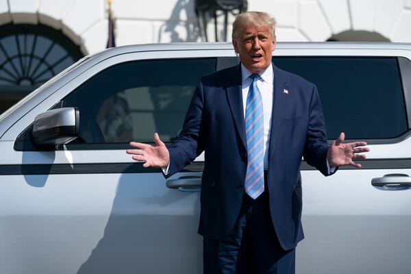 FILE - President Donald Trump talks about the Endurance all-electric pickup truck, made in Lordstown, Ohio, at the White House, Sept. 28, 2020, in Washington. (AP Photo/Evan Vucci, File)