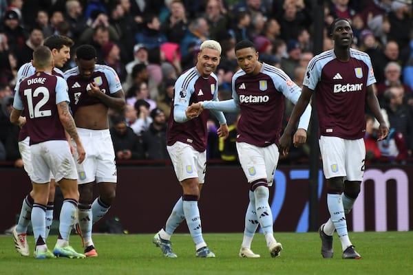 Aston Villa's Morgan Rogers, center, celebrates with teammates after scoring his side's second goal during the English Premier League soccer match between Aston Villa and Manchester City, at Villa Park in Birmingham, England, Saturday, Dec. 21, 2024. (AP Photo/Rui Vieira)