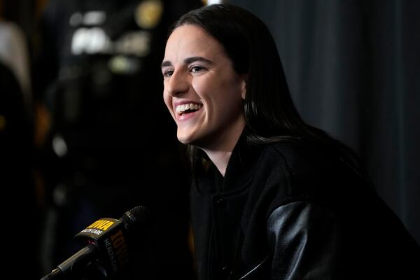 Former Iowa guard and current Indiana Fever WNBA player Caitlin Clark speaks during a news conference before an NCAA college basketball game between Iowa and USC, Sunday, Feb. 2, 2025, in Iowa City, Iowa. (AP Photo/Charlie Neibergall)