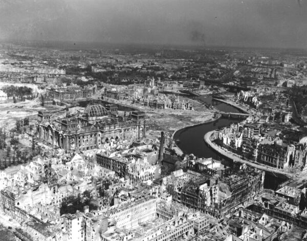 FILE - A view taken from a Cub artillery observation plane on July 10, 1945, shows vast areas of destruction in Berlin, after repeated Anglo-American air raids on the German capital. Seen on the left, center, is the heavily damaged building of the German Reichstag with its distinct cupola, in the background center are the remains of Lehrter Bahnhof, one of the city's train stations. (AP Photo, File)