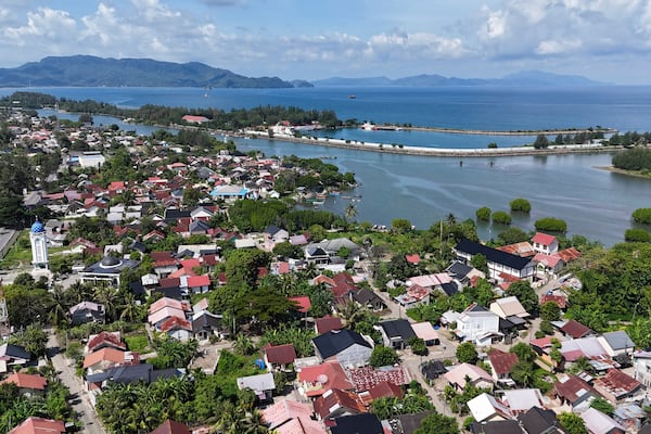 This aerial shot taken using a drone shows the now densely-populated Ulee Lheue village, one of the areas hardest hit by the Indian Ocean tsunami in 20024, in Banda Aceh, Aceh Province, Indonesia, Friday, Dec. 13, 2024. (AP Photo/Achmad Ibrahim)