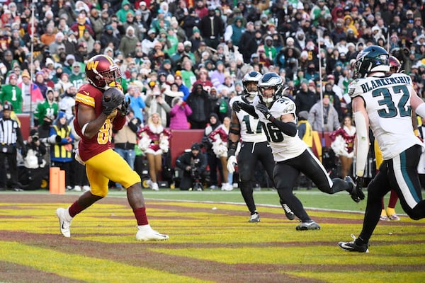 Washington Commanders wide receiver Jamison Crowder (80) makes a catch for a touchdown against the Philadelphia Eagles during the second half of an NFL football game, Sunday, Dec. 22, 2024, in Landover, Md. (AP Photo/Nick Wass)