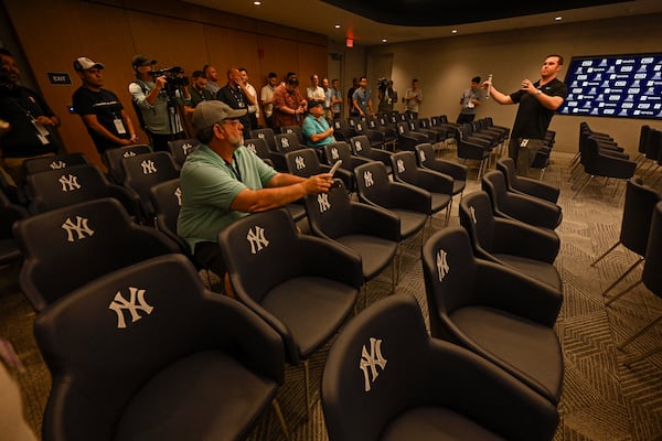 New York Yankees director of baseball operations Matthew Ferry, right, talks with the media in a team multi-purpose meeting room during a tour of the upgraded team spring training facilities, Thursday, Feb 13, 2025 at George M. Steinbrenner Field, in Tampa, Fla. (AP Photo/Steve Nesius)