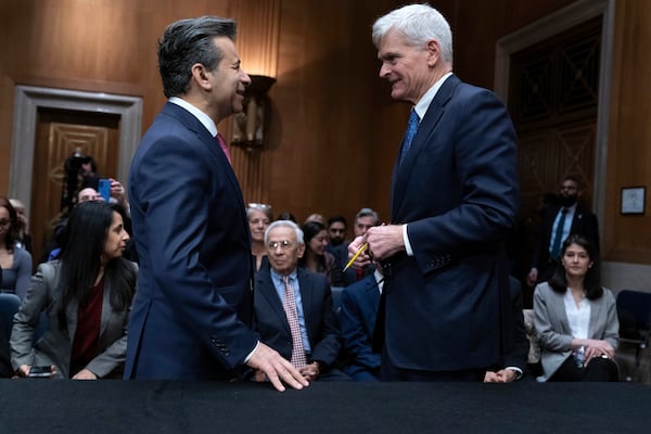 Martin Makary, left, nominated to serve as Commissioner of Food and Drugs, Department of Health and Human Services, speaks with Sen. Bill Cassidy, R-La., Chairman of the Senate Committee on Health, Education, Labor and Pensions during his nomination hearing on Capitol Hill Thursday, March 6, 2025, in Washington. (AP Photo/Jose Luis Magana)