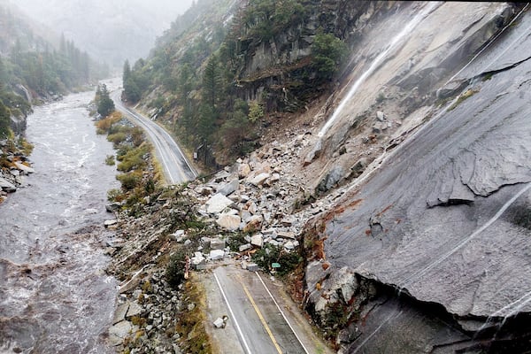 FILE - Rocks and vegetation cover Highway 70 following a landslide in the Dixie Fire zone on Oct. 24, 2021, in Plumas County, Calif. (AP Photo/Noah Berger, File)