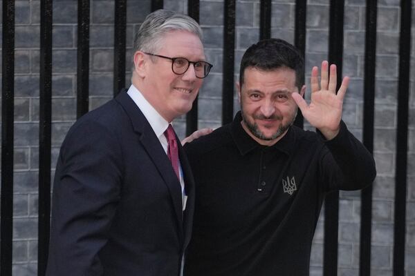 Britain's Prime Minister Keir Starmer, left, greets Ukraine's President Volodymyr Zelenskyy in Downing Street, London, England, Saturday, March 1, 2025. (AP Photo/Kin Cheung)