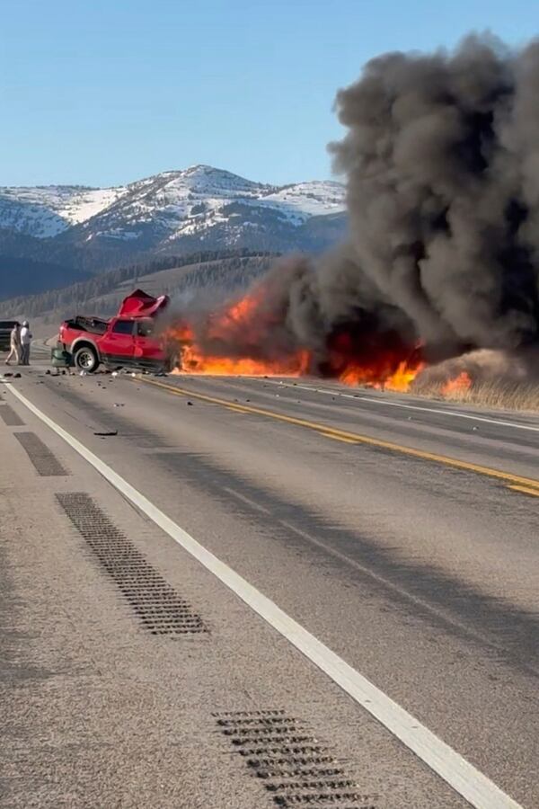 Rescue workers arrive to the scene after a deadly collision between a pickup truck and tour van near Henry’s Lake State Park in eastern Idaho on Thursday, May 1, 2025. (Roger Merrill via AP)