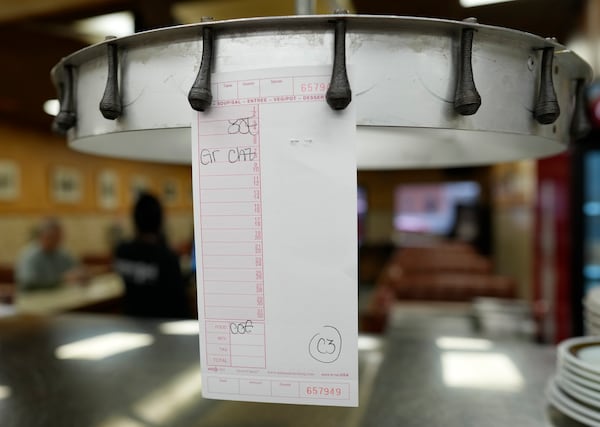 An order for three eggs over easy and a grilled cheese sandwich is posted in the kitchen at the Pepper Pod Restaurant, Thursday, Feb.13, 2025, Newport, Ky. (AP Photo/Carolyn Kaster)