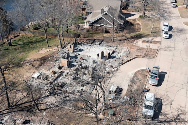 An aerial view of Andrine Shufran's burned home in the Hidden Oaks neighborhood in Stillwater, Okla., Monday, March 17, 2025, after wildfires burned through the area Friday. (AP Photo/Alonzo Adams)