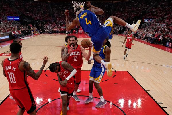 Golden State Warriors guard Moses Moody (4) dunks against the Houston Rockets during the first half of Game 5 of an NBA basketball first-round playoff series, Wednesday, April 30, 2024, in Houston. (AP Photo/David J. Phillip)
