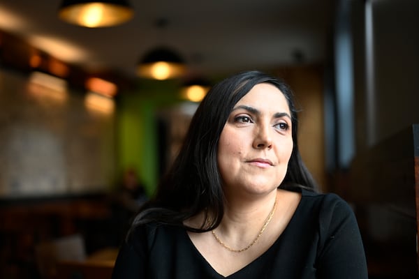 Jenn Kauffman, a semi-finalist for the 2025 Presidential Management Fellows program that was canceled due to budget cuts by DOGE sits in her neighborhood cafe on Thursday, March. 6, 2025, in Washington. (AP Photo/John McDonnell)