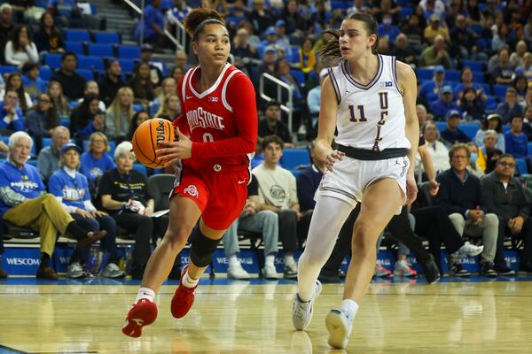 Ohio State guard Madison Greene (0) drives against UCLA guard Gabriela Jaquez (11) during the first half of an NCAA college basketball game Wednesday, Feb. 5, 2025, in Los Angeles. (AP Photo/Jessie Alcheh)