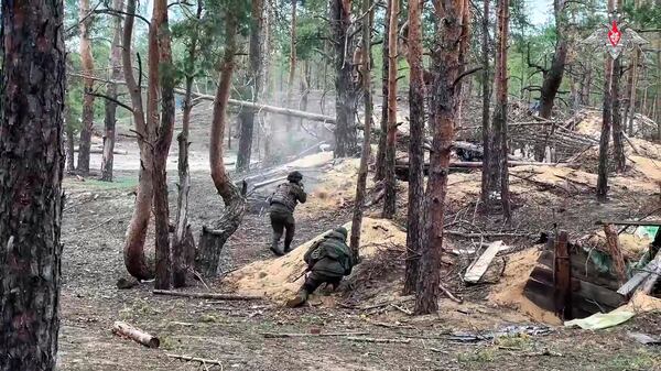 In this photo taken from video distributed by Russian Defense Ministry Press Service on Wednesday, May 21, 2025, Russian servicemen attend a combat training for assault units in an undisclosed location in Ukraine. (Russian Defense Ministry Press Service via AP)