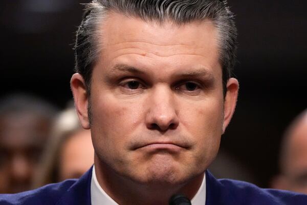 Pete Hegseth, President-elect Donald Trump's choice to be Defense secretary, appears before the Senate Armed Services Committee for his confirmation hearing, at the Capitol in Washington, Tuesday, Jan. 14, 2025. (AP Photo/Alex Brandon)