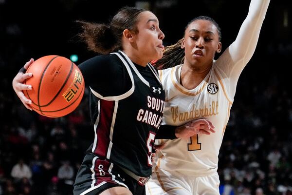 South Carolina guard Tessa Johnson (5) goes to the basket past Vanderbilt guard Mikayla Blakes (1) during the second half of an NCAA college basketball game Sunday, Feb. 23, 2025, in Nashville, Tenn. (AP Photo/George Walker IV)