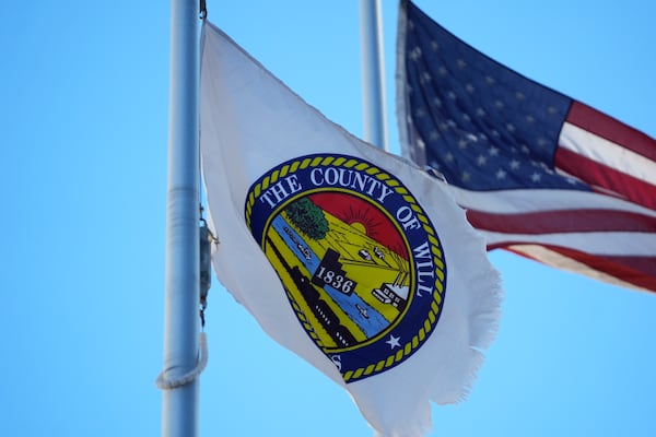 Flags blow in the wind outside Will County Courthouse where Joseph Czuba, 73, is charged with and on trial in the fatal stabbing of six-year-old Palestinian boy Wadee Alfayoumi and the wounding of his mother Hanan Shaheen, Tuesday, Feb. 25, 2025, in Joliet, Ill. (AP Photo/Erin Hooley)