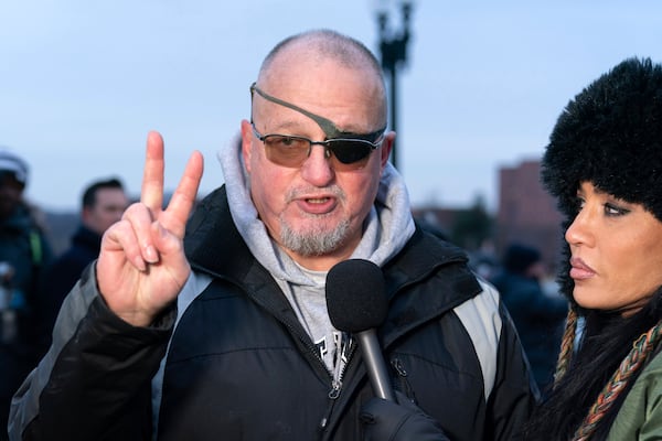 President Donald Trump supporter Oath Keepers founder Stewart Rhodes convicted on charges relating to the Jan. 6 riot at the U.S. Capitol, talks to reporters outside the DC Central Detention Facility, after being released from a jail in Maryland, in Washington, Tuesday, Jan. 21, 2025. (AP Photo/Jose Luis Magana)