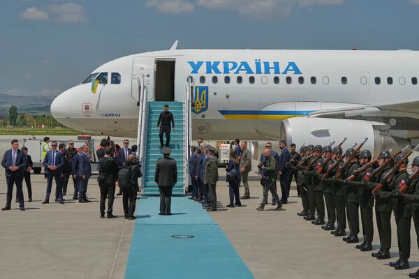 Ukrainian President Volodymyr Zelenskyy walks down the stairs from his plane upon his arrival at Esenboga airport in Ankara, Turkey, Thursday, May 15, 2025. (AP Photo/Evgeniy Maloletka)