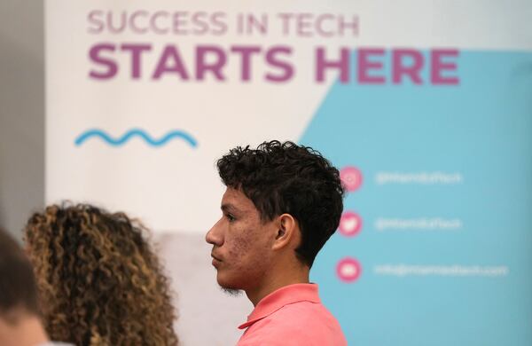 Dylan Pravia, a student at Florida International University, listens during a Hispanic Federation event in Miami, Tuesday, Jan. 28, 2025, where the organization announced a new investment from a company, to help Latinos learn digital skills. (AP Photo/Lynne Sladky)