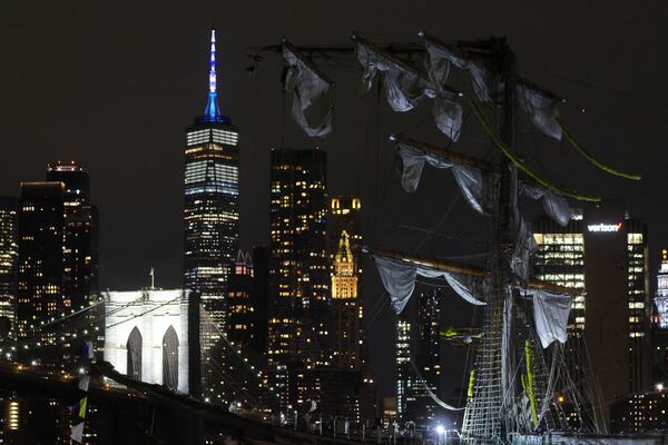 The New York skyline and Brooklyn Bridge are framed in one of the snapped masts of a Mexican Navy training ship after it collided with the Brooklyn Bridge, Saturday, May 17, 2025, in New York. (AP Photo/Yuki Iwamura)