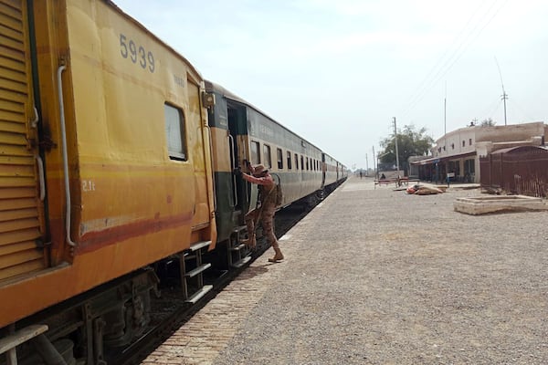 A paramilitary soldier takes position at a railway station near the attack site of a passenger train by insurgents, in Mushkaf in Bolan district of Pakistan's southwestern Balochistan province, Wednesday, March 12, 2025. (AP Photo)