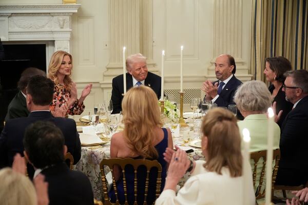 President Donald Trump attends a Kennedy Center board dinner in the State Dining Room at the White House, Monday, May 19, 2025, in Washington. (AP Photo/Manuel Balce Ceneta)