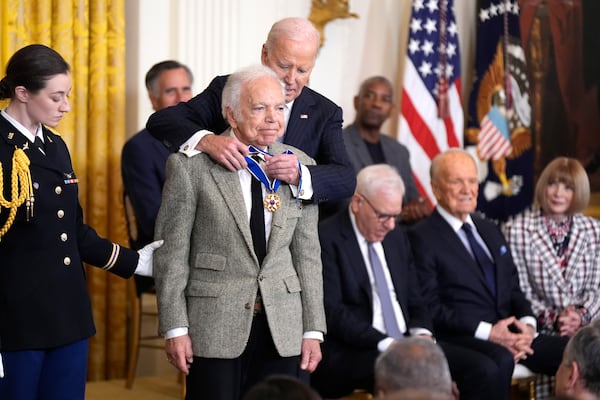 President Joe Biden, right, presents the Presidential Medal of Freedom, the Nation's highest civilian honor, to fashion designer Ralph Lauren in the East Room of the White House, Saturday, Jan. 4, 2025, in Washington. (AP Photo/Manuel Balce Ceneta)