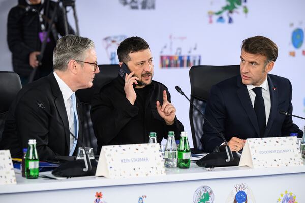 Britain's Prime Minister Keir Starmer, left, Ukraine's President Volodymyr Zelenskyy and France's President Emmanuel Macron, right, attend a plenary meeting at the beginning of a summit where the leaders of 47 European countries and organizations will discuss security, defense and democratic standards, in Tirana, Albania, Friday, May 16, 2025. (Leon Neal/Pool via AP)