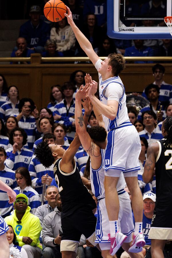 Duke's Cooper Flagg, right, blocks a shot by Wake Forest's Juke Harris, left, during the second half of an NCAA college basketball game in Durham, N.C., Monday, March 3, 2025. (AP Photo/Ben McKeown)