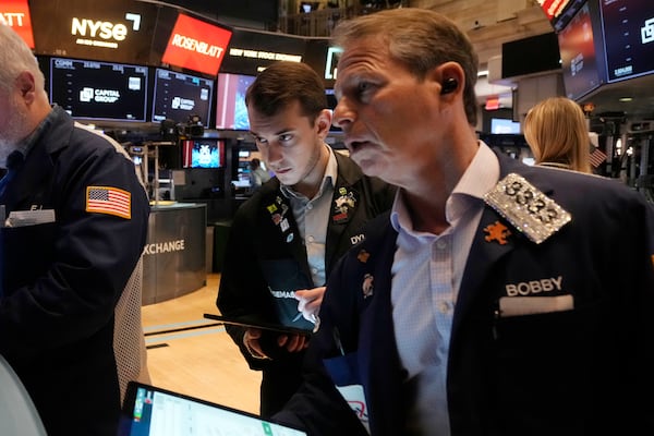 Traders work on the floor of the New York Stock Exchange, Tuesday, March 11, 2025. (AP Photo/Richard Drew)