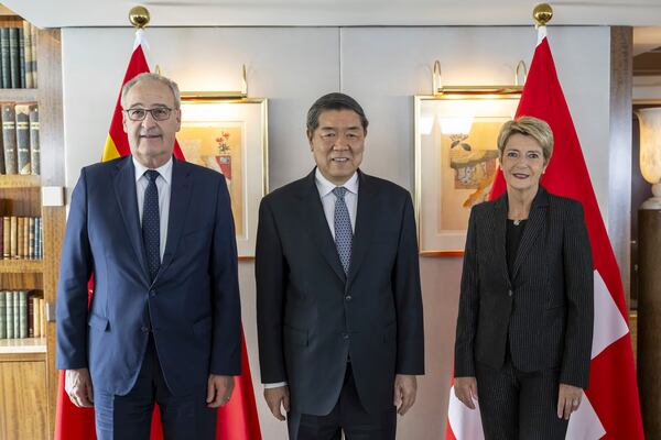 Switzerland's Economy Minister Federal Councillor Guy Parmelin, left, Chinese Vice Premier He Lifeng, center, and Switzerland's President Karin Keller-Sutter, right, pose, during a bilateral meeting between Switzerland and China, in Geneva, Switzerland, on Friday, May 9, 2025. (Martial Trezzini/Keystone via AP, Pool)