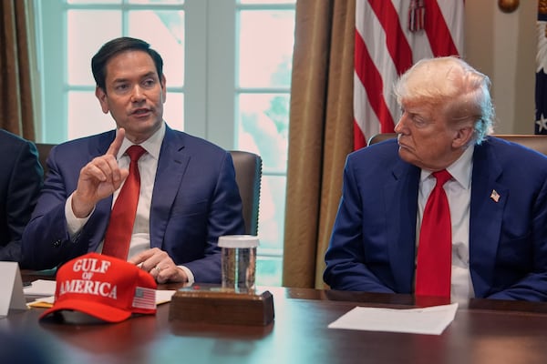 Secretary of State Marco Rubio speaks during a cabinet meeting at the White House, Wednesday, April 30, 2025, in Washington, as President Donald Trump look on. (AP Photo/Evan Vucci)