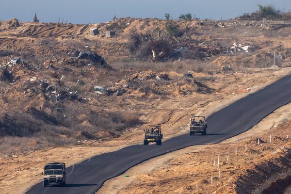 Israeli military vehicles move inside the Gaza Strip, as seen from southern Israel, Tuesday, Jan. 7, 2025. (AP Photo/Ariel Schalit)