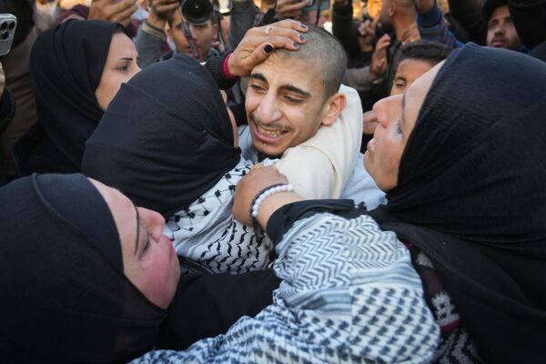 Mohammed Sahloul, 17, is greeted by relatives after being released from a 420 days detention in an Israeli prison in Khan Younis, Gaza Strip, Thursday, Feb. 27, 2025. (AP Photo/Abdel Kareem Hana)