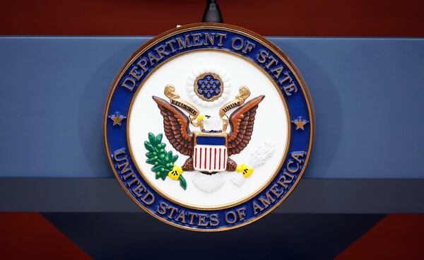 FILE - The seal of the State Department is seen at the Washington Passport Agency, July 12, 2016, in Washington. (AP Photo/Alex Brandon, File)