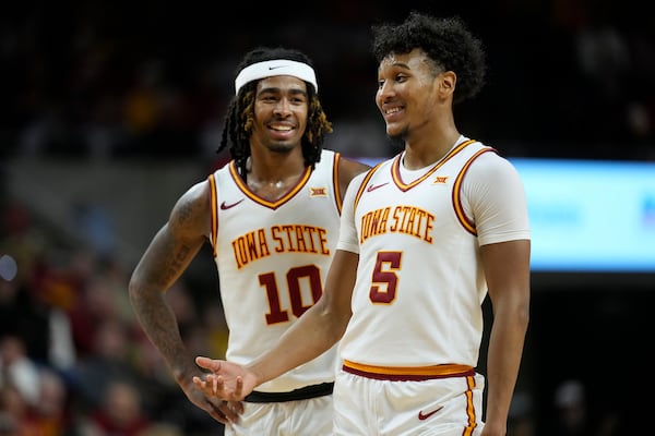 Iowa State guard Curtis Jones (5) talks with teammate guard Keshon Gilbert (10) during the second half of an NCAA college basketball game against Baylor Saturday, Jan. 4, 2025, in Ames, Iowa. (AP Photo/Charlie Neibergall)