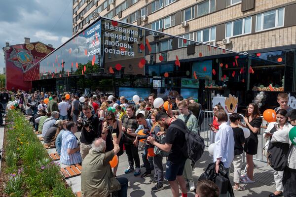 FILE - People line up to visit a newly opened fast food restaurant in a former McDonald's outlet in Bolshaya Bronnaya Street in Moscow, Russia, Sunday, June 12, 2022. The sign reads "The Name Changes, Love Remains." (AP Photo/Dmitry Serebryakov, File)