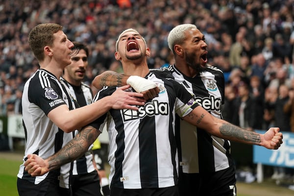 Newcastle United's Bruno Guimaraes, centre, celebrates scoring his side's third goal of the game only to see it ruled out by VAR , during the English Premier League soccer match between Newcastle United and Aston Villa at St. James' Park, in Newcastle upon Tyne, England, Thursday, Dec. 26, 2024. (Owen Humphreys/PA via AP)