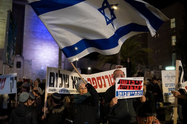 Israelis take part in protest demanding the continuation of the war against Hamas and the resettlement of the Gaza Strip, in Jerusalem, Thursday, Feb. 27, 2025. (AP Photo/Leo Correa)