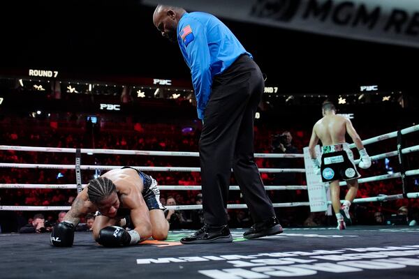 Jesus Ramos Jr. knocks down Jeison Rosario in a middleweight boxing match Saturday, Feb. 1, 2025, in Las Vegas. (AP Photo/John Locher)